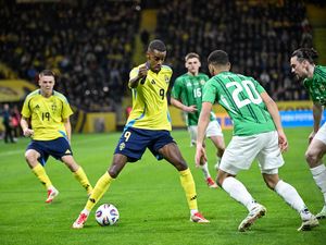 Sweden’s Alexander Isak, centre, takes on Northern Ireland’s Brodie Spencer