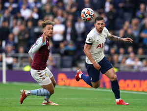 Aston Villa's Matty Cash (left) and Tottenham Hotspur's Pierre-Emile Hojbjerg battle for the ball