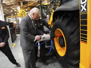 Supporting image for story: King greeted by cheering crowds at JCB headquarters in Staffordshire