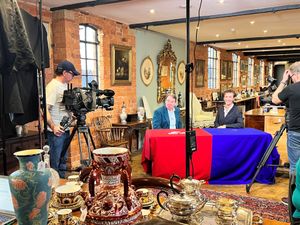 Ashley Jones filming the auctioneer chat with presenter Eric Knowles