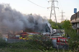 A blaze broke out at a glazing business in Titford Lane, Rowley Regis, with smoke pouring out of the roof. Photo: SnapperSK