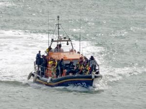 A group of people thought to be migrants are brought in to Dover (Gareth Fuller/PA)