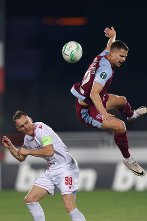 Aston Villa's Leander Dendoncker, right, is challenged by Zrinjski's Nemanja Bilbija