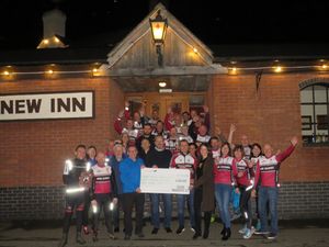 Supporting image for story: Newport cycling club celebrates £4,000 donation to veteran support centre