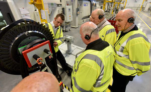 Pensioners from Cannock Chase Probus Club are given a guided tour by staff member Gareth Slater