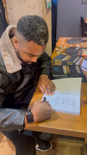 Author AJR Brooks signing copies of his debut novel Man-March: No Safe Haven following its recent release.