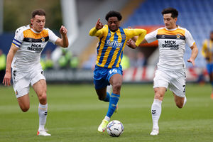 Nathanael Ogbeta of Shrewsbury Town and George B Williams of Cambridge United (AMA)