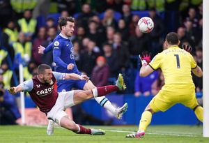 Chelsea's Ben Chilwell (centre) shoots under pressure