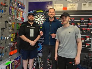 L-R: Iain Mathers, Cllr Adam Davies and Jayden Harper at new darts stall at Brierley Hill Market