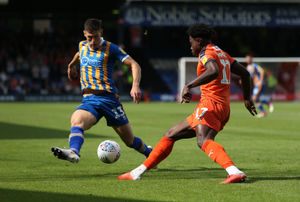 James Bolton of Shrewsbury Town and Pelly Ruddock Mpanzu of Luton Town. (AMA)