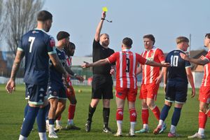 Brad Bood booked for a tackle on Dan Lafferty.