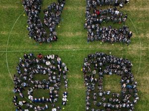 Students and staff mark the moment and pay respect to those that fought for us.