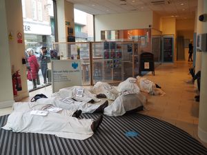 Supporting image for story: Extinction Rebellion campaigners hold 'corpse' protest inside Shrewsbury bank