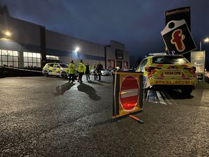 Officers have sealed off the car park.