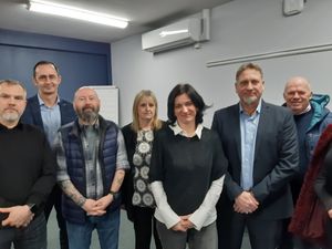 Applicant Natalie Sereda (fifth from left with white sleeves) with supporters at the meeting. Picture: LDRS