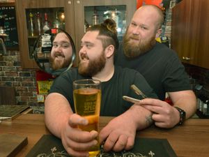 Supporting image for story: Make mine a short, back and cider! Barbers serve up drinks to customers in for a trim