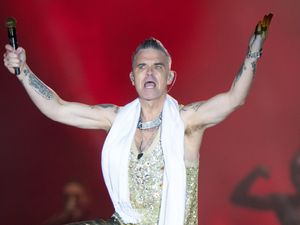 Supporting image for story: Robbie Williams says his children can watch new documentary about him when older