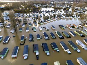 Supporting image for story: Residents at flooded waterside parks urged to stay away from their homes