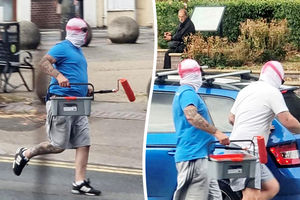 Two men wearing St George's masks have been captured on camera painting England flags on roundabouts and zebra crossings across Walsall.
