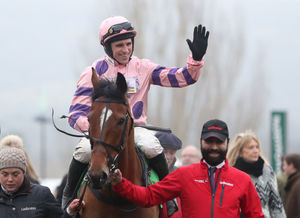 Harry Skelton celebrates his victory on Oldgrangewood in the Paddy Power Handicap Chase during the New Year's Day meeting at Cheltenham Racecourse