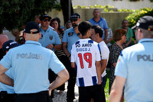 A mourner wearing a football shirt in tribute of Diogo Jota at his wake being held at Sao Cosme Chapel in the town of Gondomar near Porto
