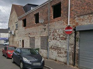 Supporting image for story: Walsall council says three flats built without permission at back of convenience store can stay