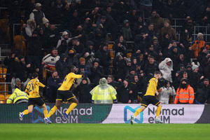 Wolves players wheel away in celebration (Photo by Michael Regan/Getty Images)
