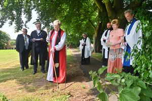 The Bishop of Shrewsbury, Rev. Sarah Bullock, consecrating the land.