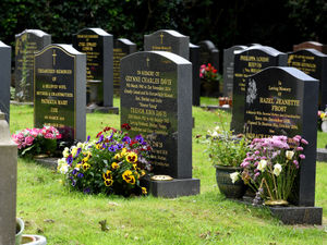 Supporting image for story: Row breaks out around rules over leaving presents and flowers on gravestones
