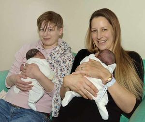 Jennie (left) and Mikki holding the twins.