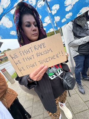 There were placards in support of the woman who was attacked