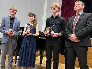 Supporting image for story: Musician crowns winners of school's music festival