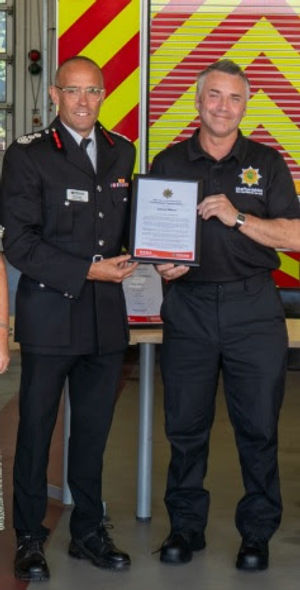 Chief Fire Officer Rob Barber with Ade Wilkes