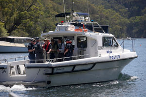 Police on the Hawkesbury River, near where the seaplane crashed