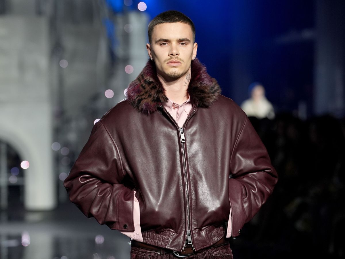 Romeo Beckham and Rosie Huntington-Whiteley on catwalk at London Fashion Week