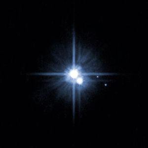A 2006 image from the Hubble Space Telescope showing Pluto and three of its five moons