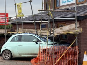 Supporting image for story: Crash leaves car embedded in wall of Ellesmere vets days before extension is finished