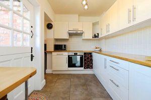 The modern kitchen and utility space opens directly onto the garden, combining everyday practicality with countryside charm