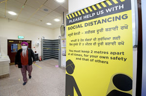 Clear instructions in different languages help attendees to the Gurdwara to know what the guidance is