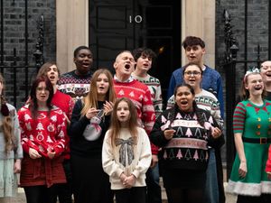 Sir Ed Davey performs Love is Enough with the Bath Philharmonia Carers’ Choir performing outside Number 10 Downing Street