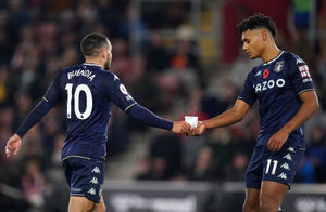 Aston Villa's Anwar El Ghazi (left) passes a message from manager Dean Smith to team-mate Ollie Watkins