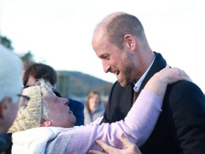 Supporting image for story: William hugged by well-wisher as he meets young marine conservationists