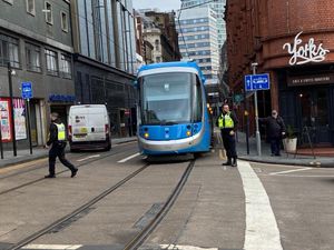 Supporting image for story: Car smashes into moving tram in city centre