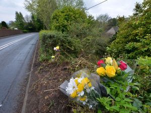 Floral tributes left at the side of the B4368 at Diddlebury