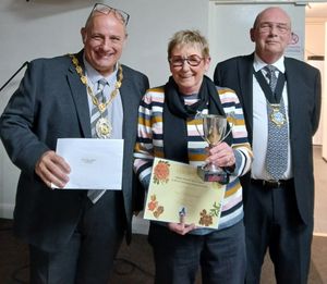 Sue Harrison took home the award for Best Front Garden. Sue (centre) received her award from Mayor Tim Manton (left) and Deputy Mayor Phil Glover