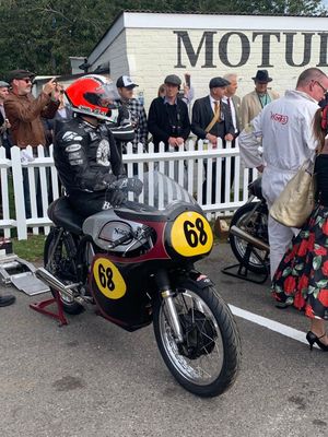 Michael Rutter sat on the Manx Norton ready to race at The Goodwood Revival