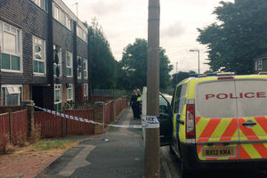 Police tape cordons off the scene