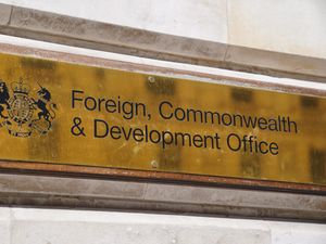 The Foreign, Commonwealth and Development Office brass sign on a wall