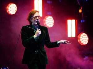 Jarvis Cocker singing on stage