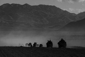 A convoy rehearses maneouvres in the desert 